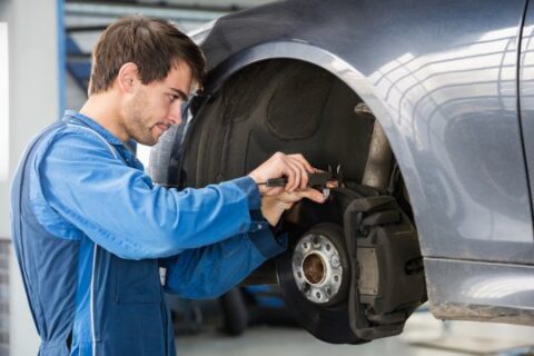 Mechanic reparing tyre