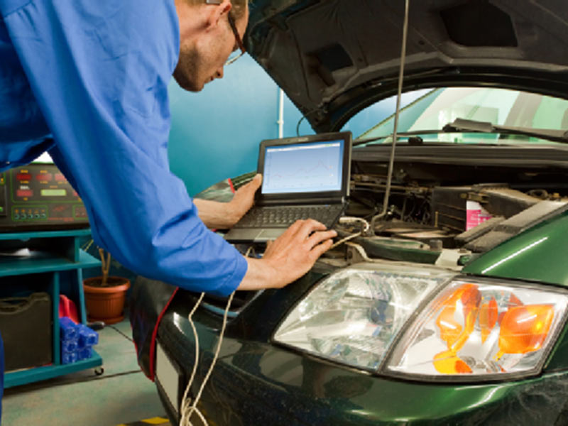 man supervising on laptop