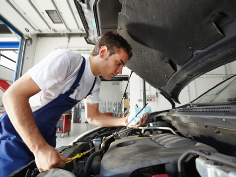 mechanic with car