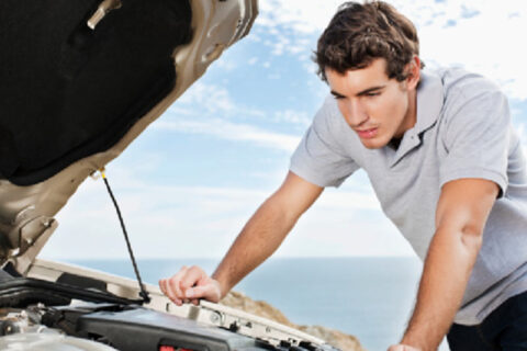 man checking car issues