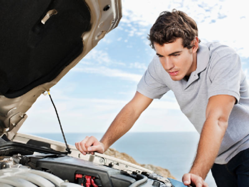 man checking car issues