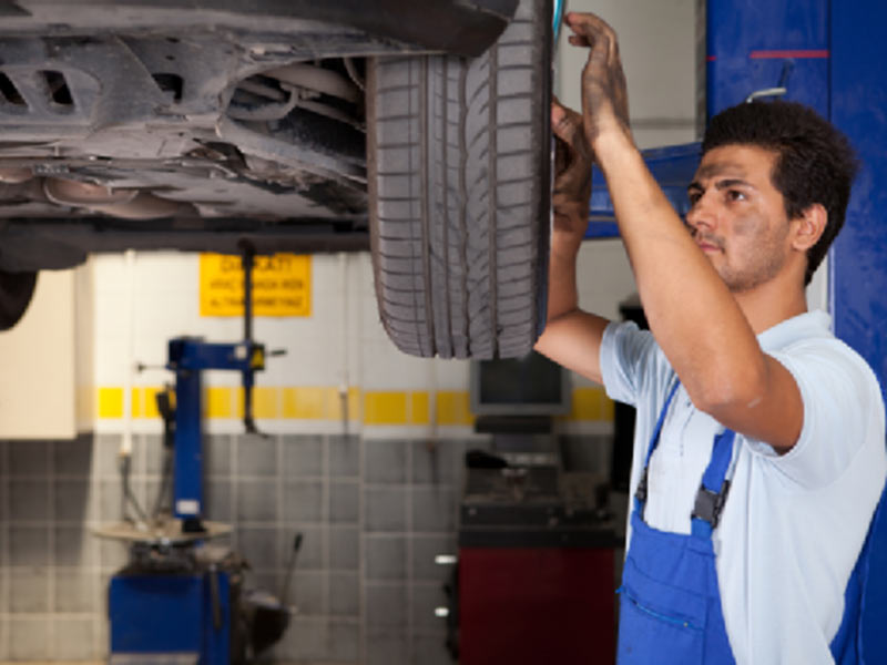 man repairing tyre