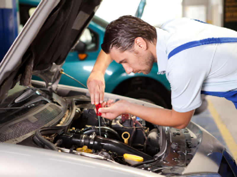 mechanic repairing engine