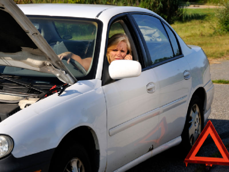 woman car got stuck in middle of road