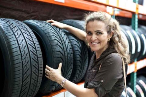 Lady holding a tire
