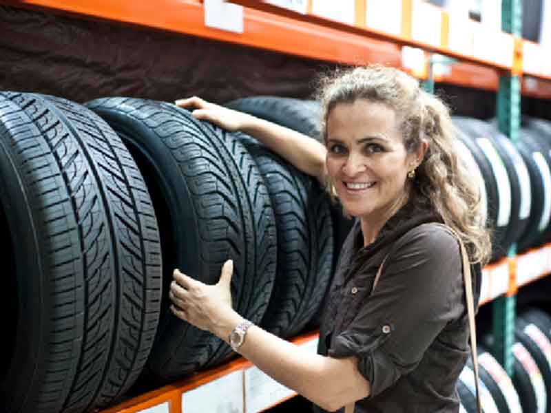 Lady holding a tire