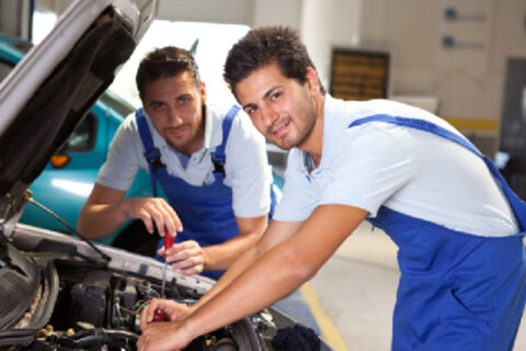 two mechanic fixing car