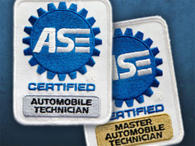 two automobile technician badges