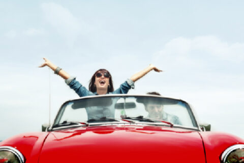 women enjoying in her car