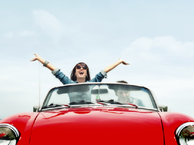 women enjoying in her car