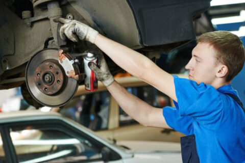 mechanic changing brakes