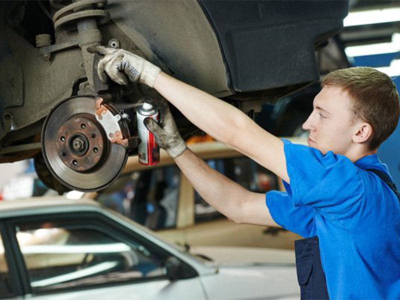 mechanic changing brakes