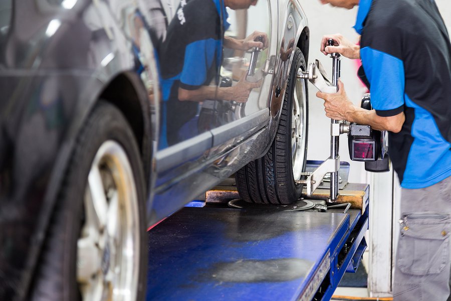 Man fitting brakes of tyre