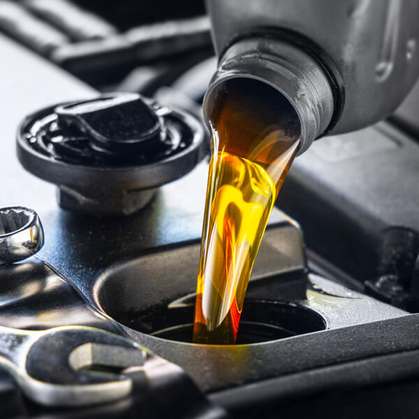 oil being poured into engine