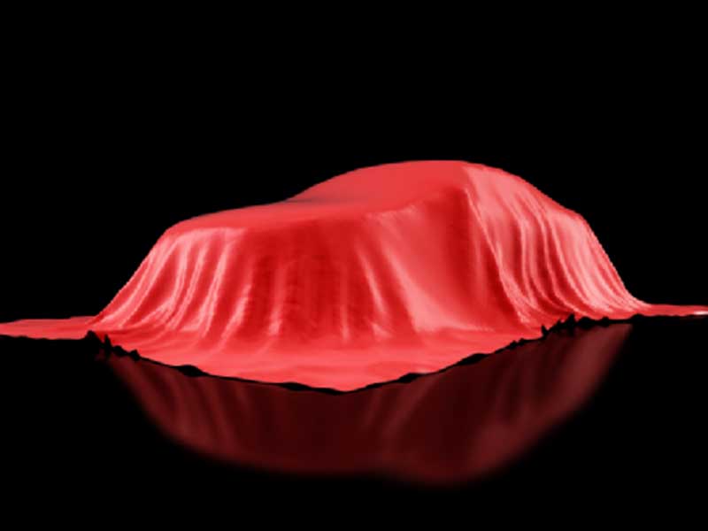  a car covered with a red cloth