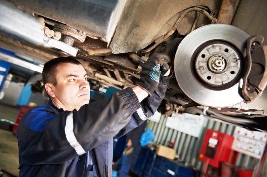 man fitting some brake 