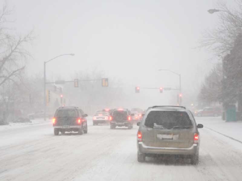 cars moving on a snowy road