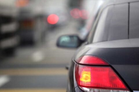 image of backside of a car on a road