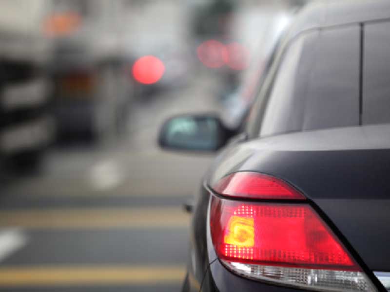 image of backside of a car on a road