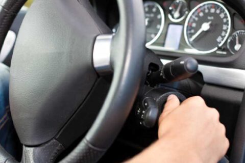 inside view of a car starting the ignition of a car