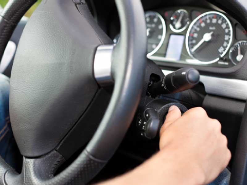 inside view of a car starting the ignition of a car