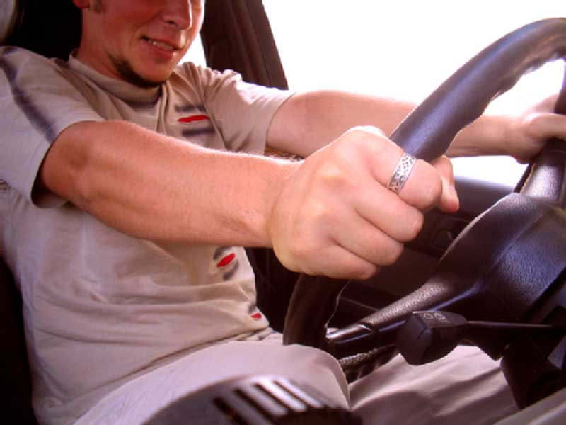 man driving a car