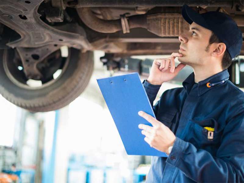 mechanic under car